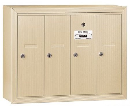Beige four-door wall-mounted mailbox with locks and a U.S. Mail label.