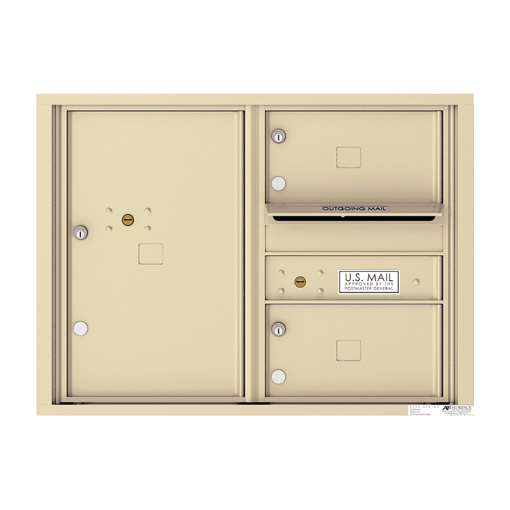 Beige wall-mounted mailbox unit with multiple compartments and U.S. Mail label.