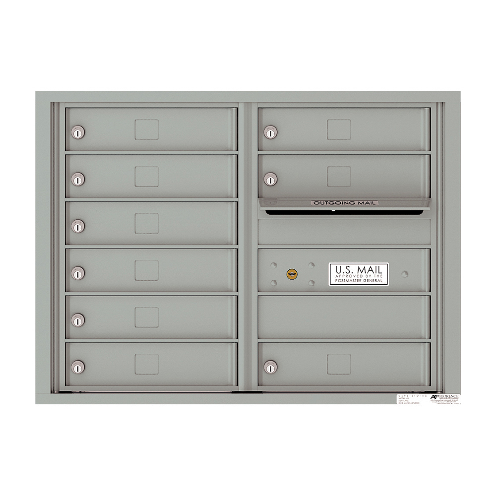 Gray wall-mounted cluster mailbox with multiple compartments and outgoing mail slot.