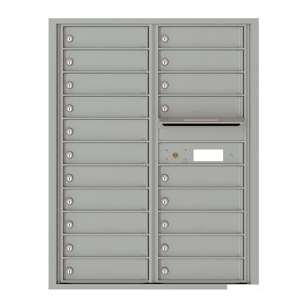 Gray metal wall-mounted mailbox unit with multiple locked compartments and a mail slot.