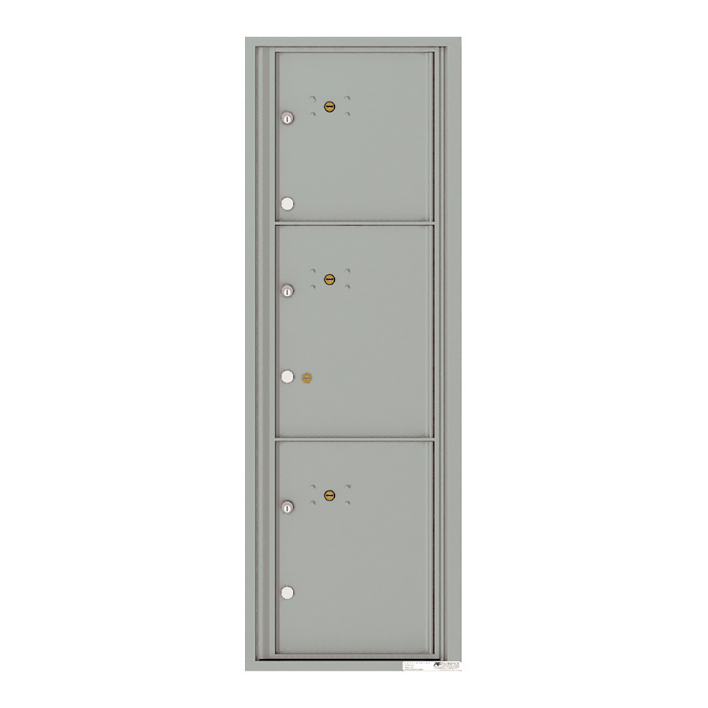 Three gray metal mailbox compartments with locks and keyholes.
