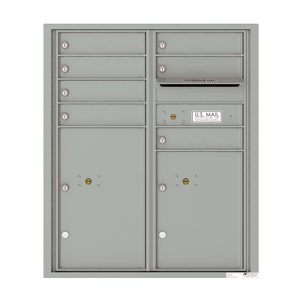 Gray wall-mounted cluster mailbox with multiple compartments and an outgoing mail slot.