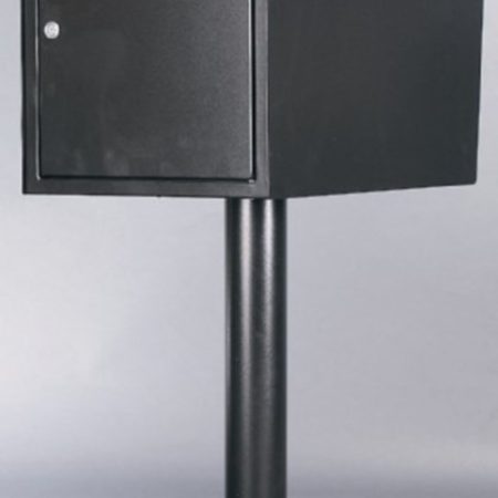 Black metal mailbox on a tall pedestal stand against a gray background.