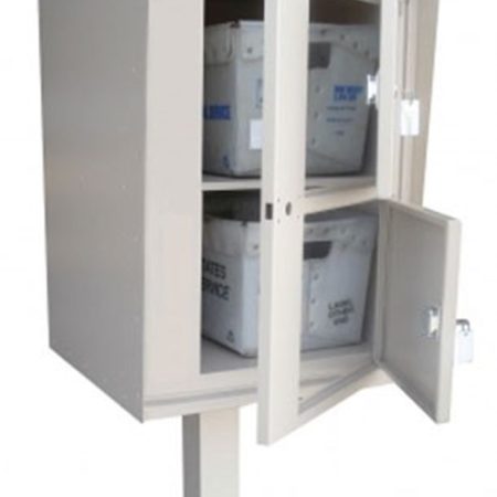 Metal mailbox with two open compartments holding postal service bins.